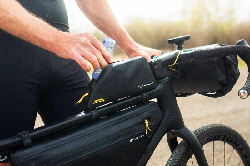 apidura-expedition-bolt-on-top-tube-pack-lifestyle-3.jpg